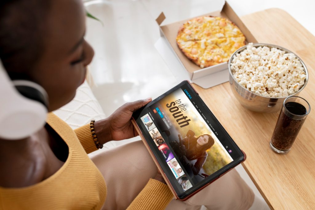 Black woman streaming movies with budget-friendly Netflix VPNs